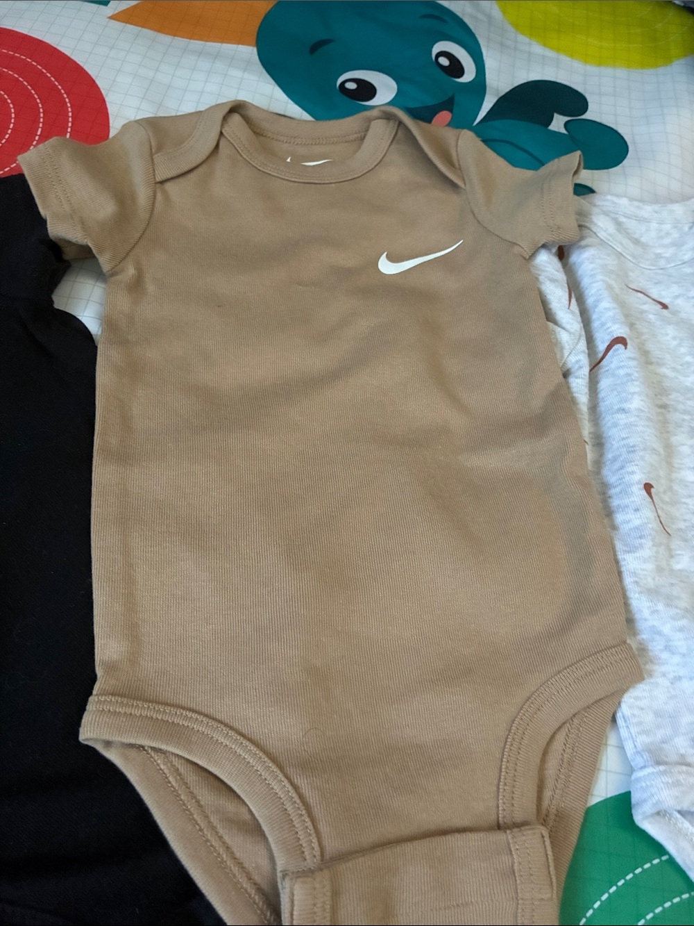 Nike Tan Baby One-Piece Bodysuit with White Swoosh
